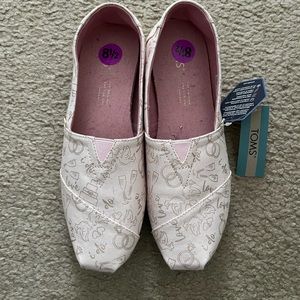 Light pink Toms bridal themed shoes.